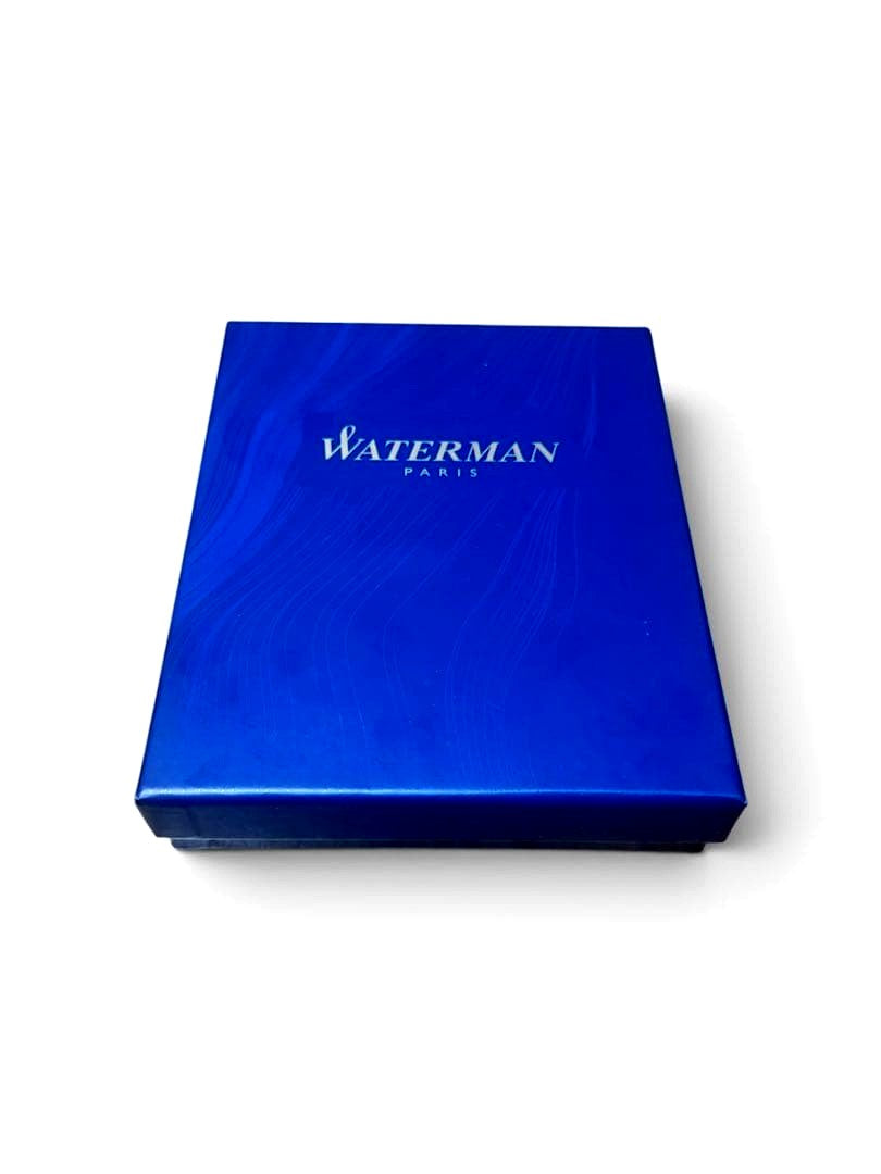 WATERMAN ballpoint pen with black body and blue dedicated pen case set on white background