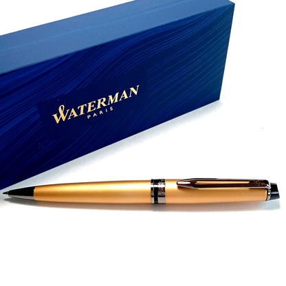 Waterman Expert Metallic Gold RT Ballpoint Pen with sleek metallic finish and black grip, 142mm long