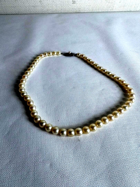 Close-up of Mikimoto Akoya Pearl Necklace with 7mm white pearls and 43cm length