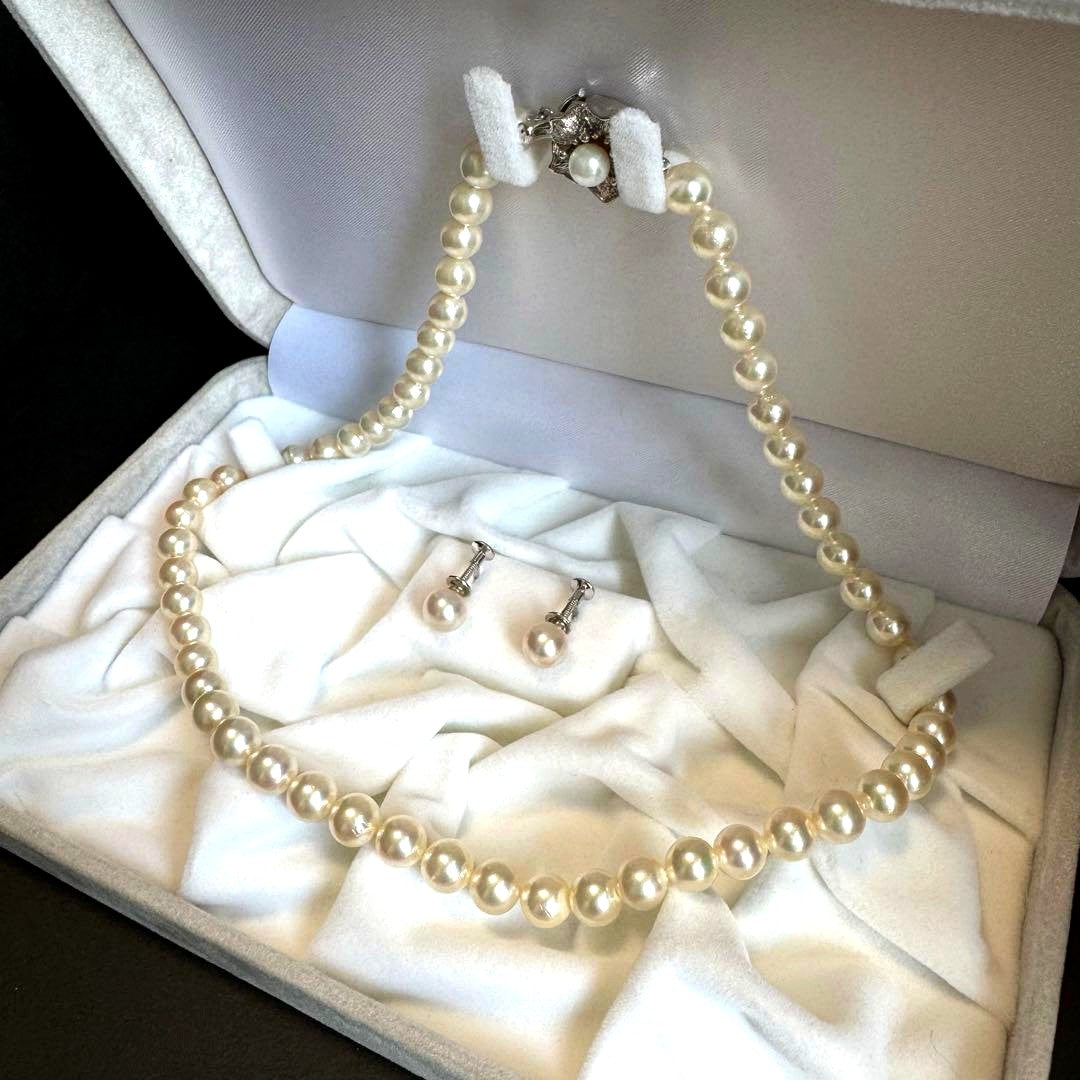 Akoya pearl necklace and earrings set featuring 7.3mm white and cream pearls displayed without accessory case