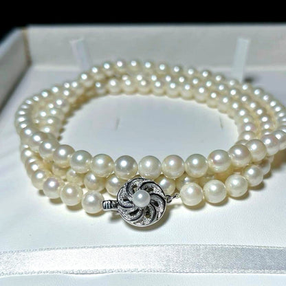 Akoya long pearl necklace with round 6.5-7.0mm white pearls on silver chain, 82cm length