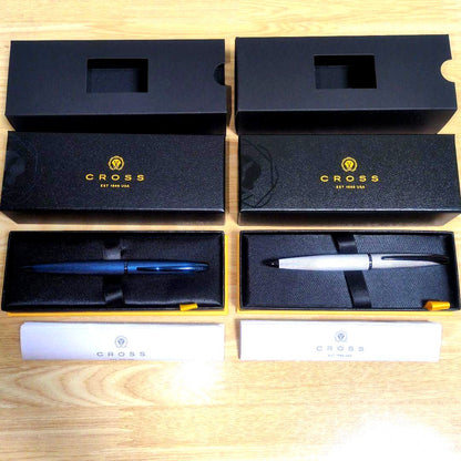 Cross ATX model pens in dark blue and brushed chrome, unused with minor box scratches