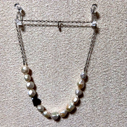 Agete pearl pattern necklace with delicate beads and elegant design on a white background