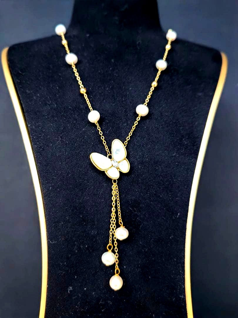 White pearl necklace with white mother-of-pearl butterfly pendant and 5.7mm freshwater pearls on 46cm chain