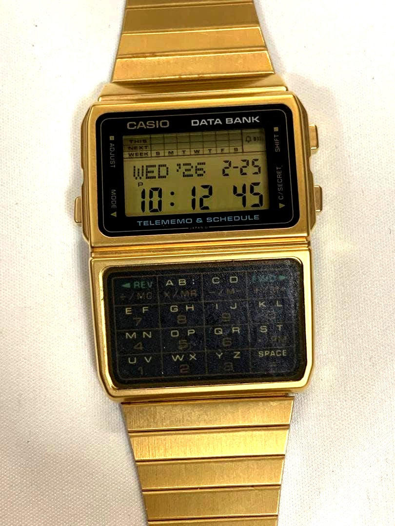 Casio Data Bank digital wristwatch with calculator function, used condition, displaying time and calculator keys