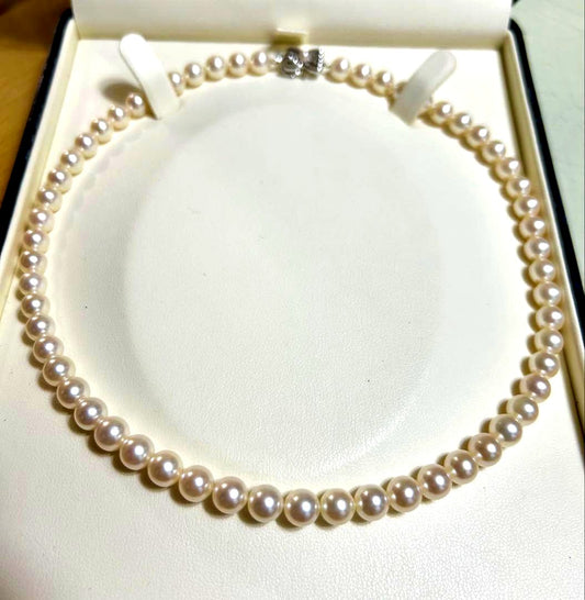 Tasaki Akoya pearl necklace with 7mm pearls and 42cm length featuring a branded clasp