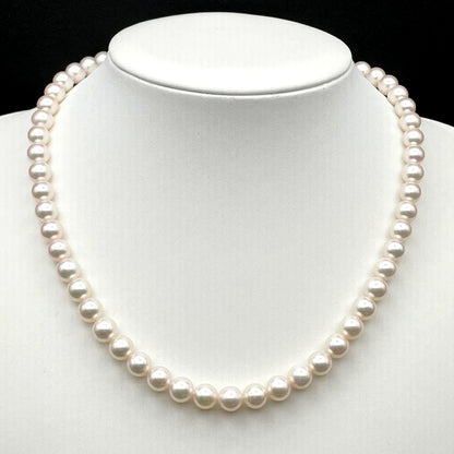 Tasaki Akoya pearl necklace with 7.0-7.5mm pearls and silver clasp on a white background