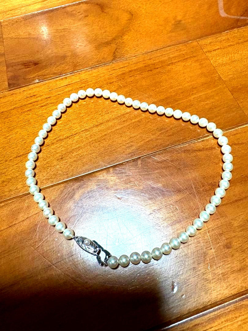 Mikimoto white pearl necklace with 58 round pearls sized 6.0-6.4mm in a single strand
