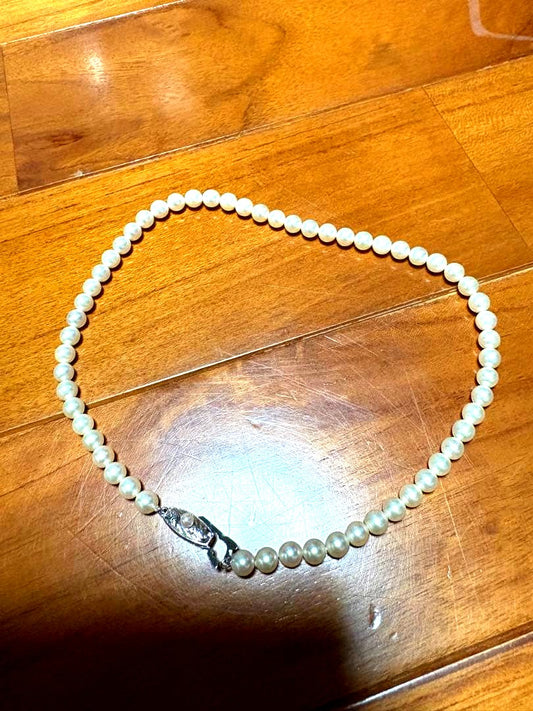 Mikimoto white pearl necklace with 58 round pearls sized 6.0-6.4mm in a single strand