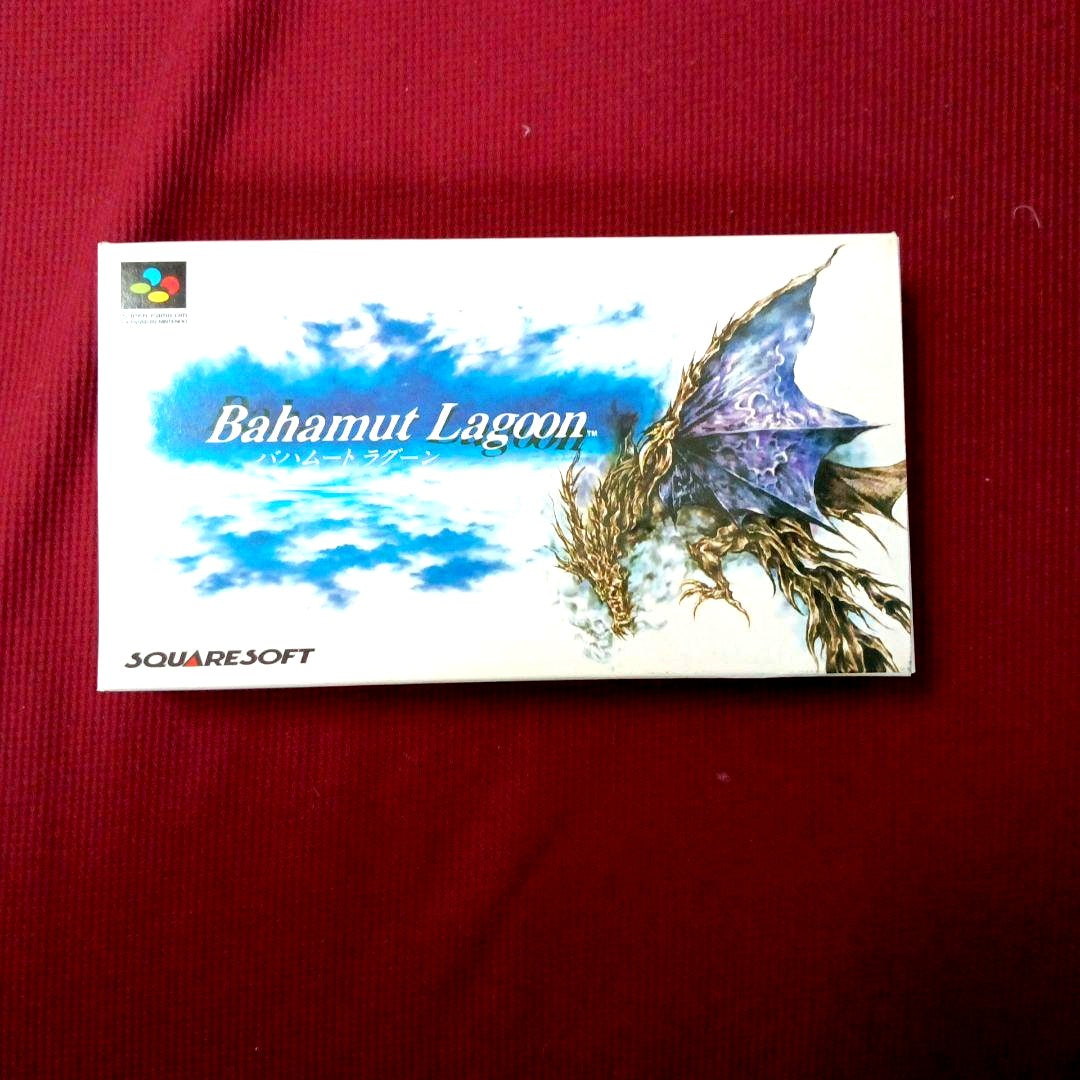 Super Famicom Bahamut Lagoon game with box, manual, advertisement, and dedicated postcard