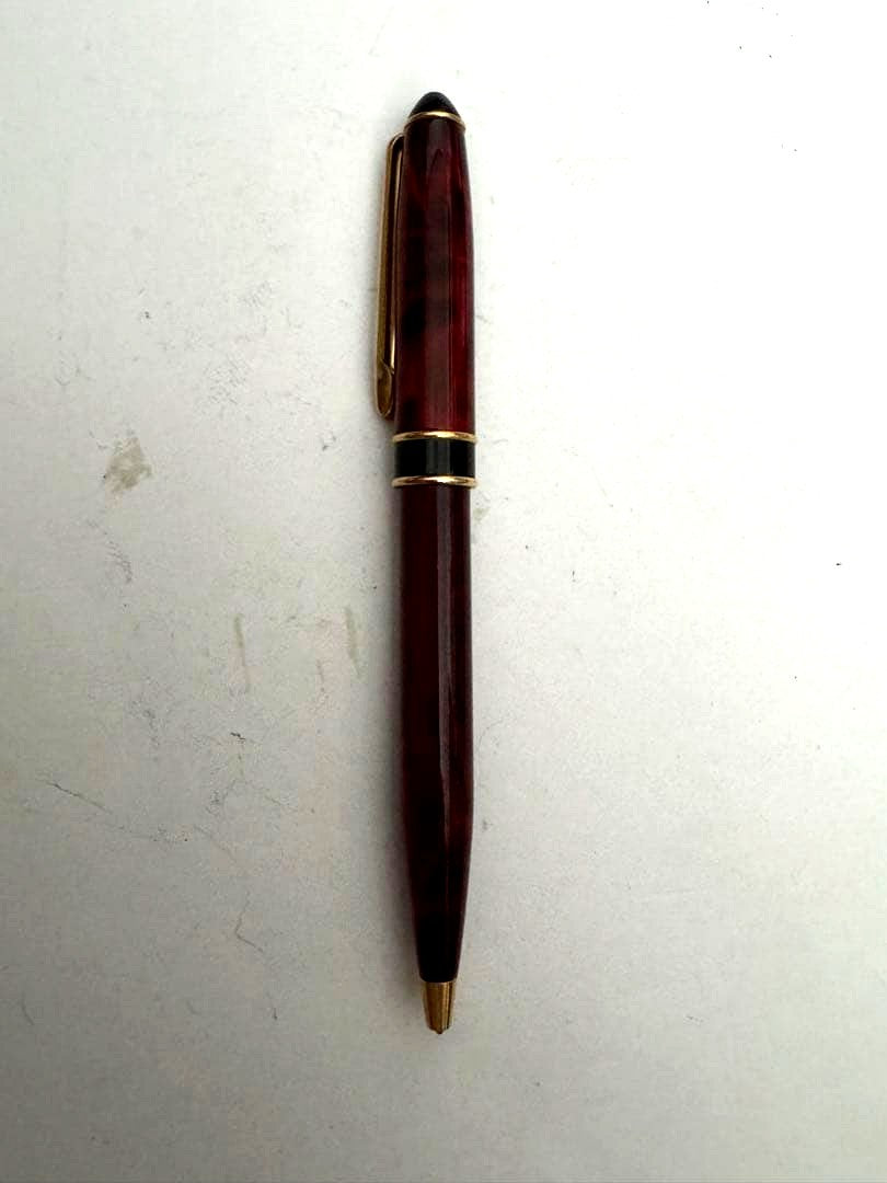 Waterman Marble Pattern ballpoint pen in red marble with gold trim and twist mechanism