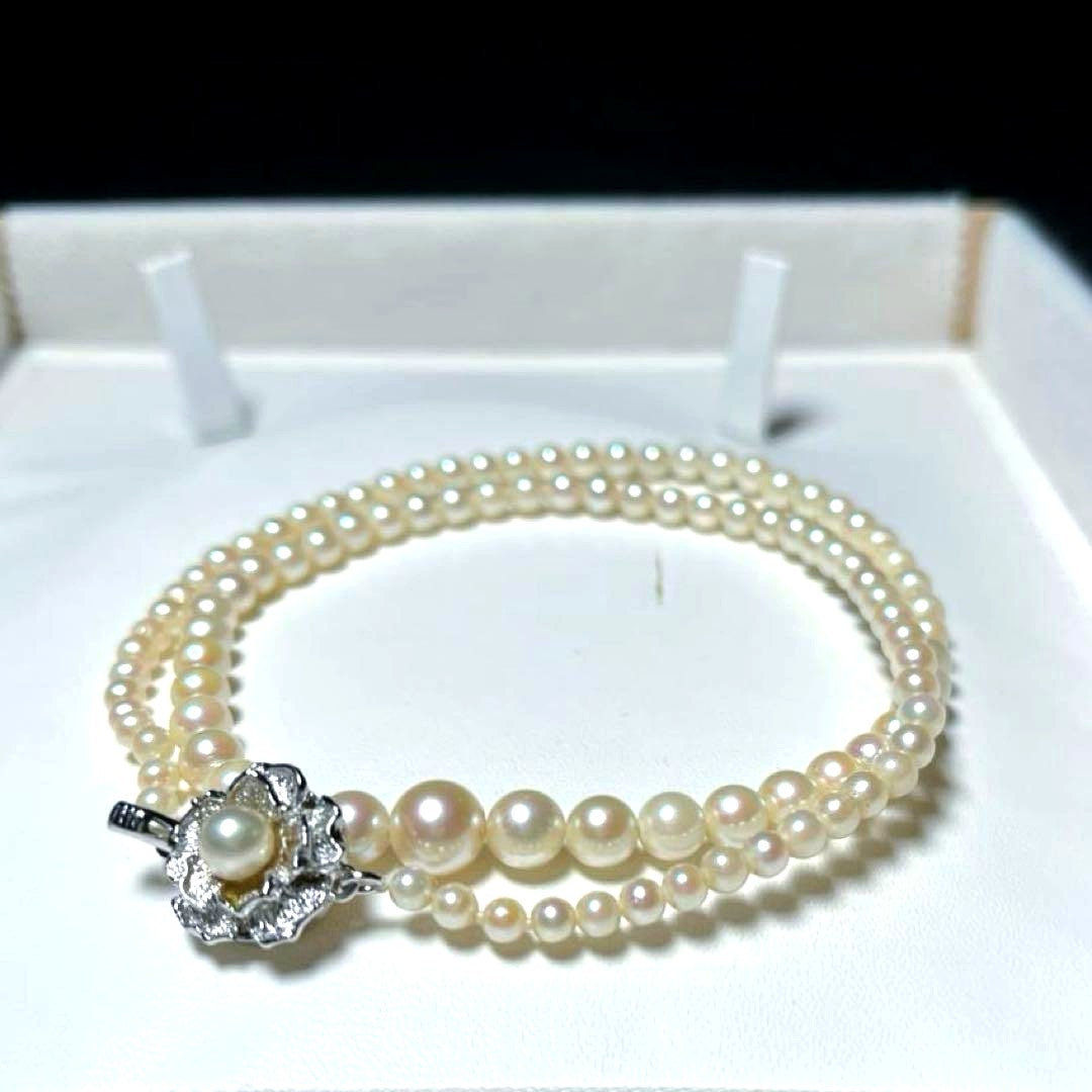 Akoya pearl necklace with round white pearls 3.3-7.4mm and silver stamp on a 45cm chain