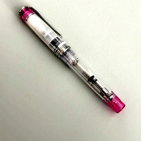 PILOT PRERA fountain pen clear pink body with medium nib tip shown uncapped
