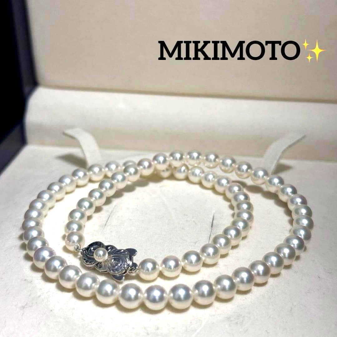 Mikimoto Akoya pearl necklace with 6.5mm pearls and silver clasp on a white background