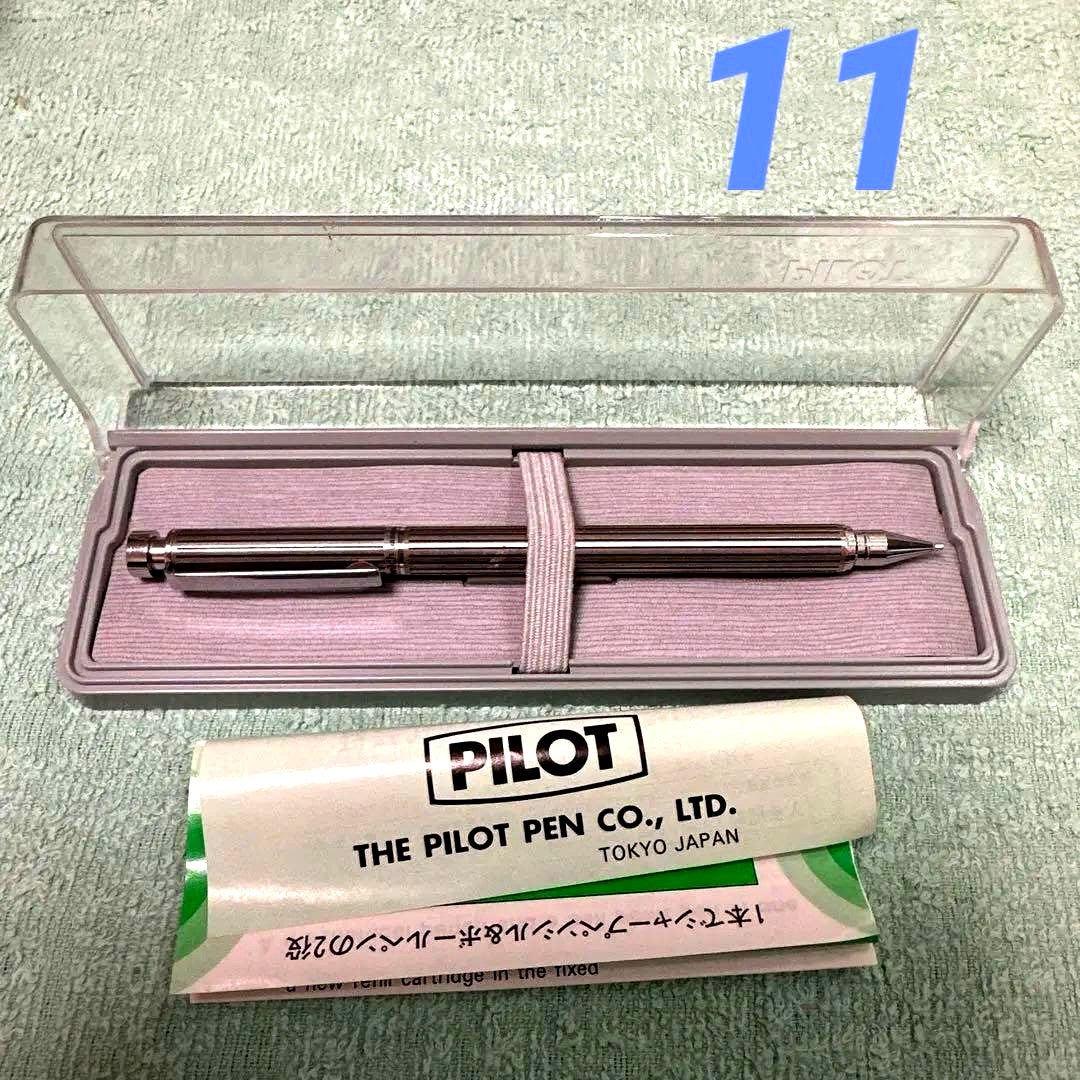 Silver Pilot Switch key-engraved pen with fine tip and stripe design beside its case