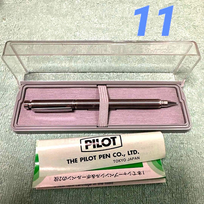 Silver Pilot Switch key-engraved pen with fine tip and stripe design beside its case