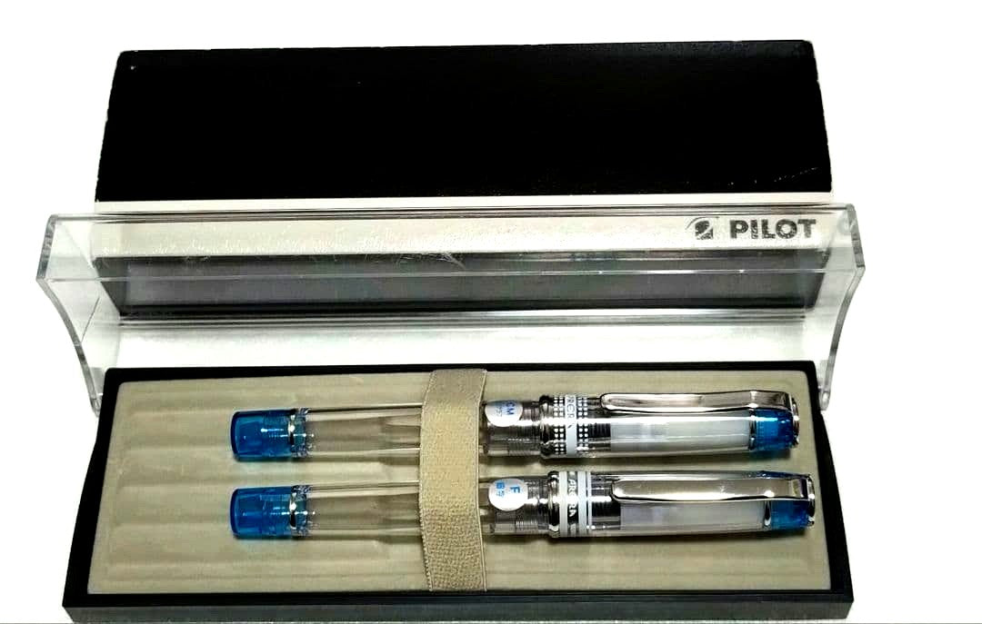 Pilot Prera fountain pen with transparent blue body and fine F nib alongside calligraphy CM nib