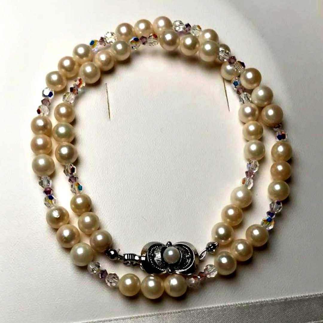 Akoya pearl and crystal necklace measuring 46.5cm with 6.6-6.9mm pearls, styled for dining events