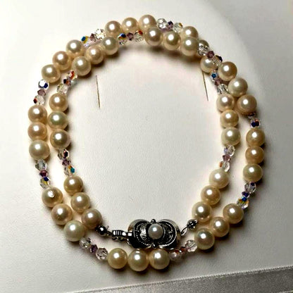 Akoya pearl and crystal necklace measuring 46.5cm with 6.6-6.9mm pearls, styled for dining events