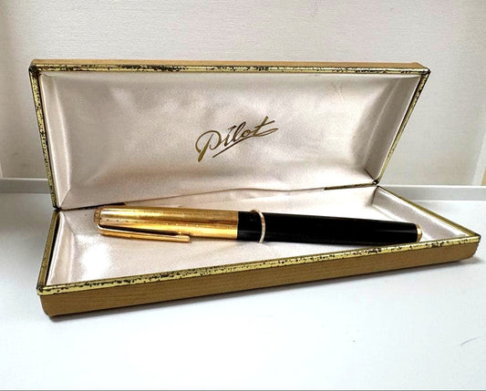 Vintage Pilot Super 300 fountain pen with 14K nib and accompanying case shown on white background