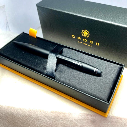 Cross black ballpoint pen with twist mechanism and included case on white background