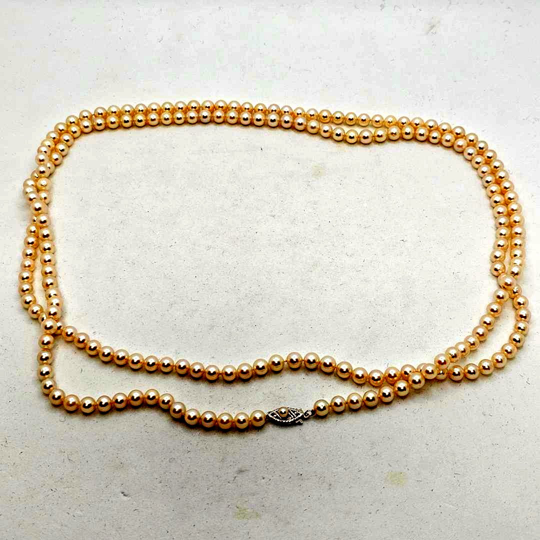 Akoya Pearl necklace 105cm long with 5mm white pink pearls and 10 karat white gold clasp