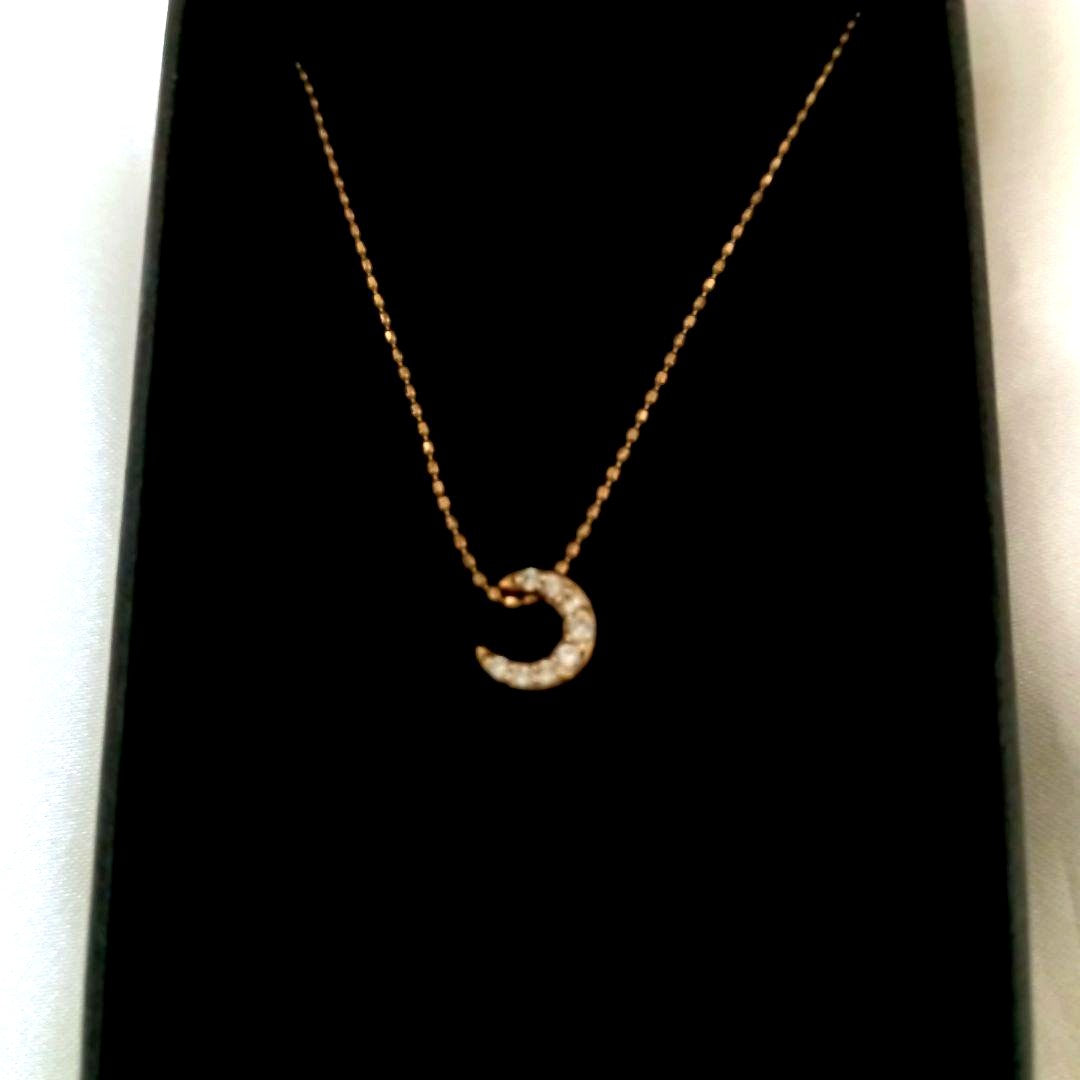 Agete Crescent Moon Diamond Necklace with gold chain and moon-shaped diamond pendant