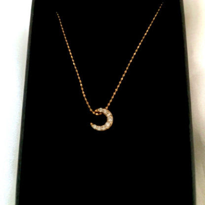 Agete Crescent Moon Diamond Necklace with gold chain and moon-shaped diamond pendant
