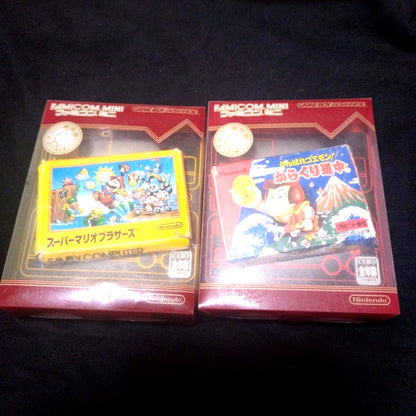 Super Mario Brothers and Kurakuri Dōchū Game Boy Advance yellow and red cartridges with games 01 and 20
