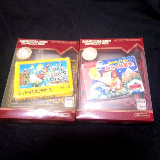 Super Mario Brothers and Kurakuri Dōchū Game Boy Advance yellow and red cartridges with games 01 and 20