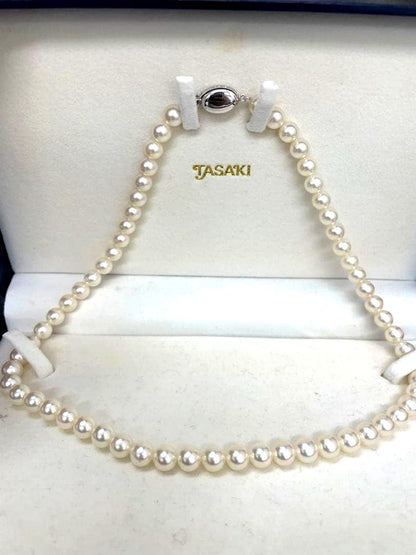 TASAKI Pearl Necklace with 6 mm pearls and 26 cm length displayed on white background