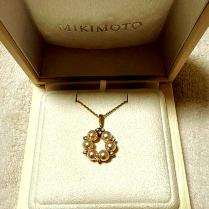 Mikimoto Pearl Diamond Necklace with 5.4mm pearl set in K18 yellow gold weighing 4.8 grams