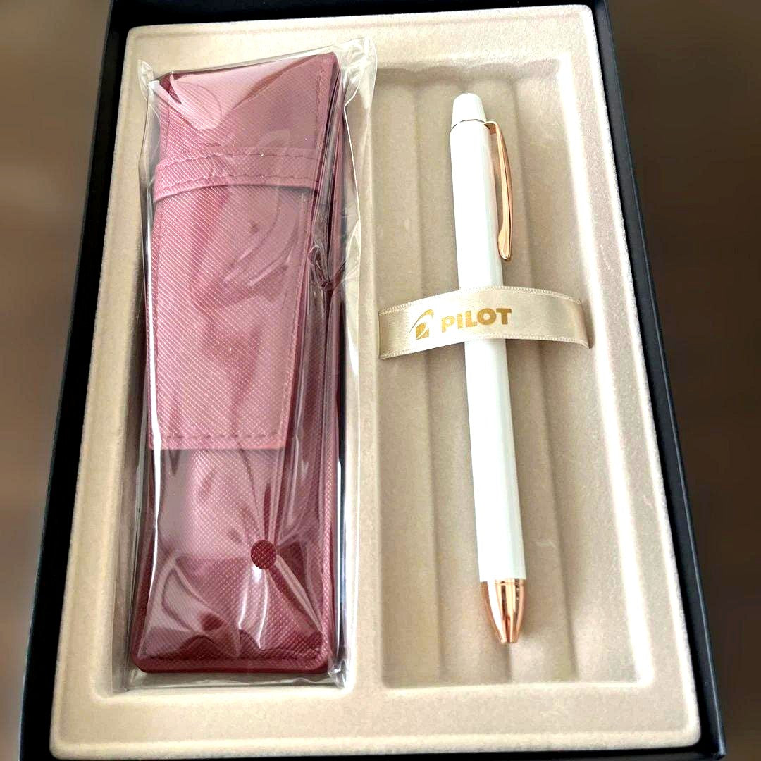 Pilot white ballpoint pen with included white case on a plain background