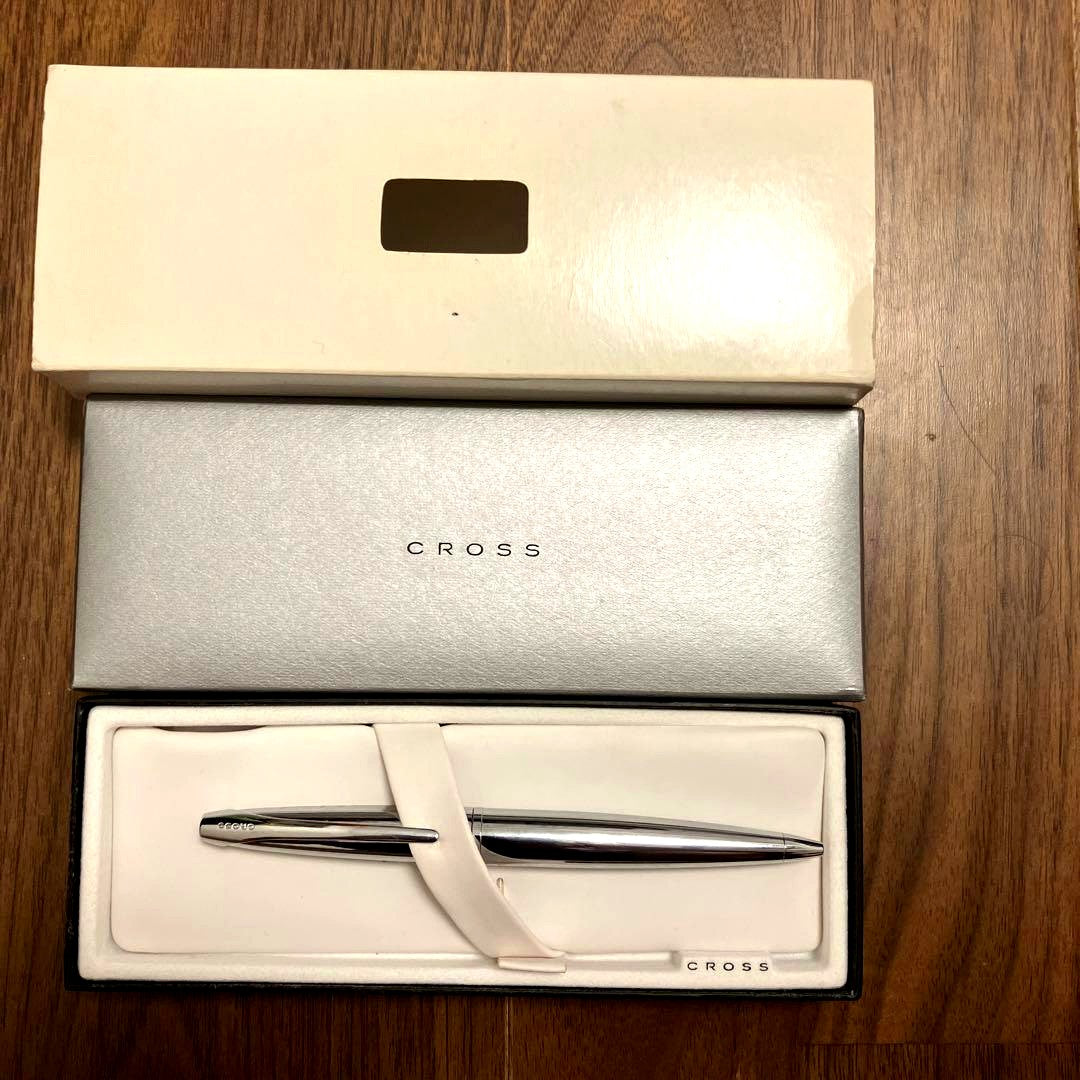 New Cross ballpoint pen with rotating tip and black ink featuring a small English cursive company name