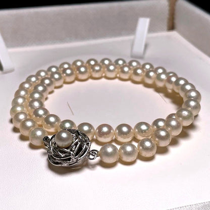 Auspicious Akoya Pearl Necklace with 6.5-7.0mm round white pearls on a silver chain, 40.6cm length