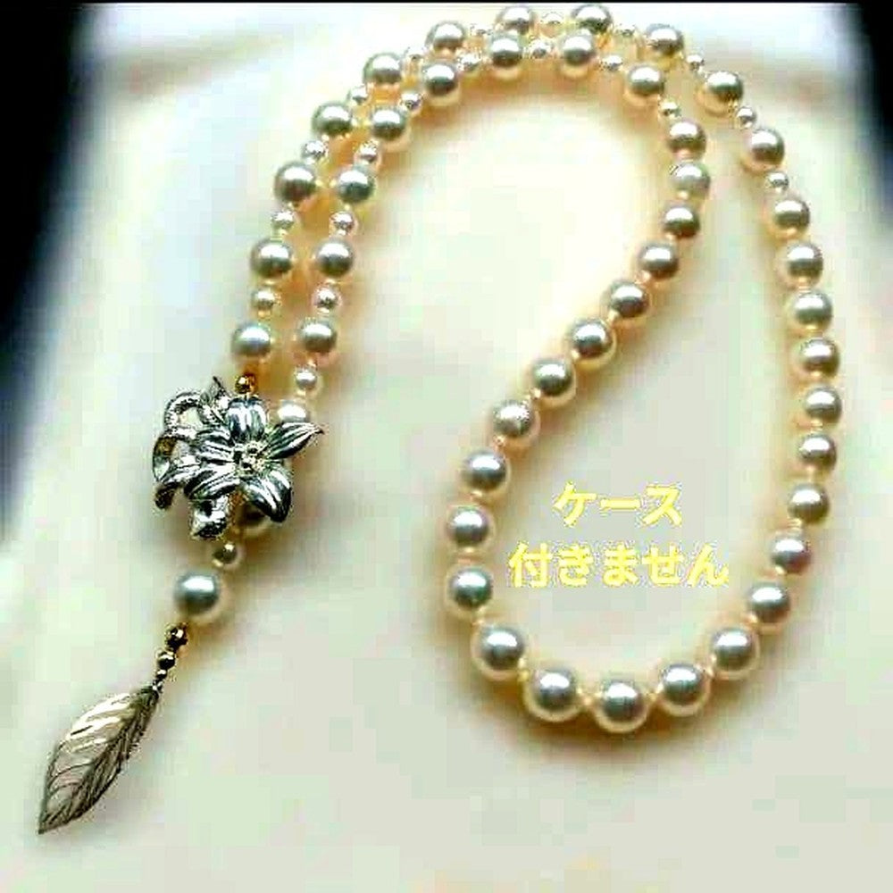 Honmei pearl necklace about 56cm long with 22 small 5mm and larger 8.2mm Akoya pearls