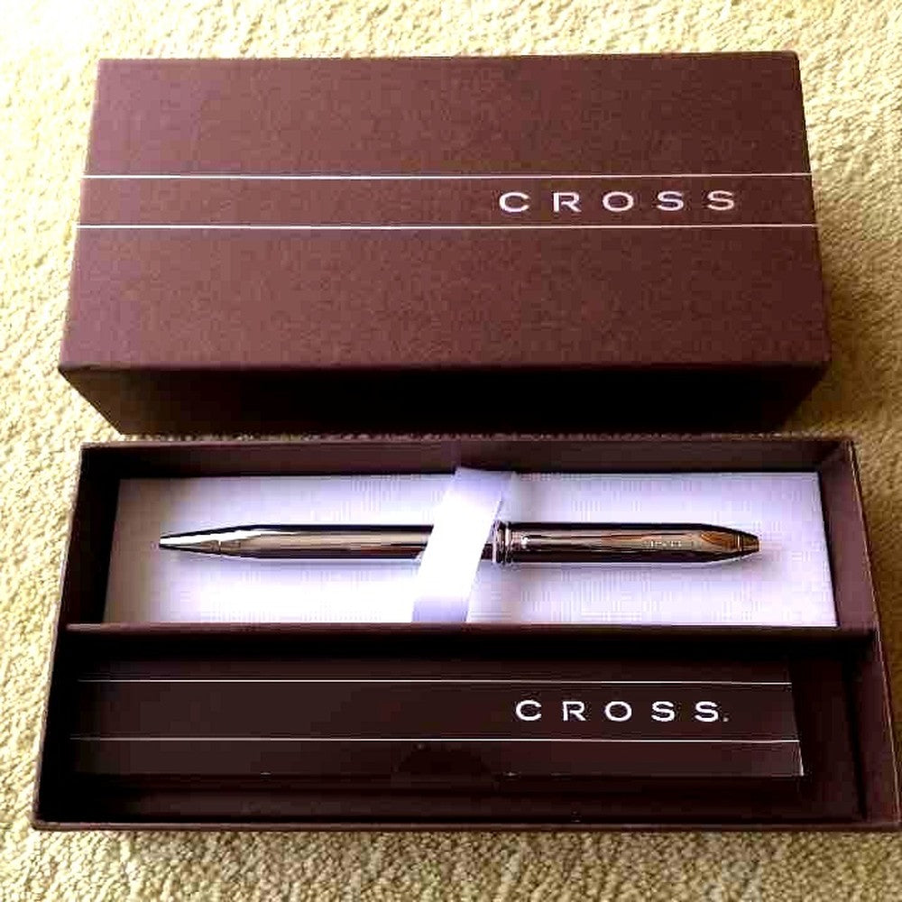 New unused Cross Ballpoint Pen in its original box with sleek silver and black design