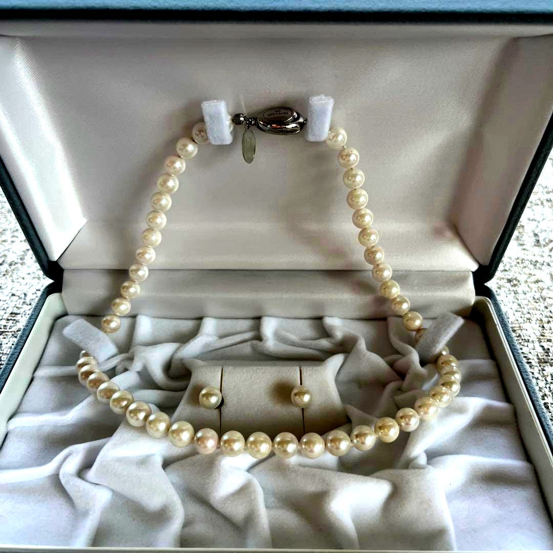 Akoya Pearl 3-piece set with necklace featuring single-pearl pendant and titanium earrings displayed in a gray case
