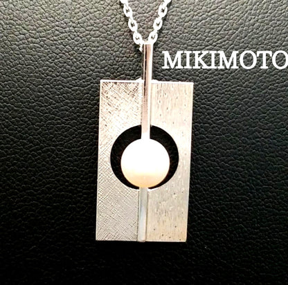 Mikimoto silver plate pearl ladies necklace with 6mm pearl and silver chain showing MS charm on pendant back
