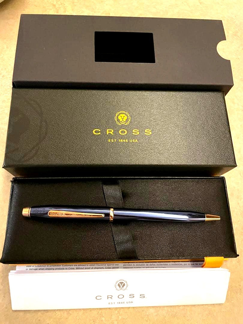 CROSS ballpoint pen in blue with gold accents, metal body, unused condition, displayed with its dedicated box