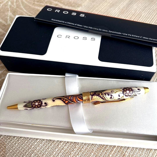 CROSS Botanica Gold ballpoint pen with gold finish displayed alongside its dedicated case