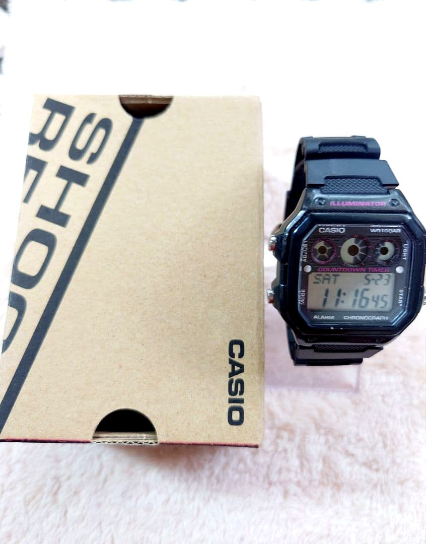 Casio AE-1300WH black digital watch with countdown timer, alarm, and chronograph features