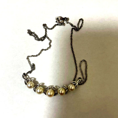 Mikimoto silver necklace with 5.7-6.0mm round pearls weighing 4.5 grams