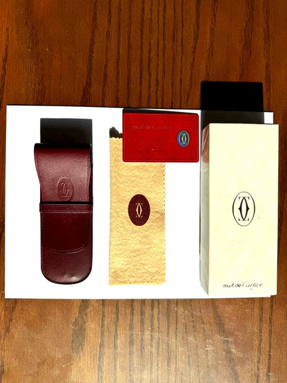 Mut de Cartier wine red genuine leather case with cleaning cloth, cards, and box displayed