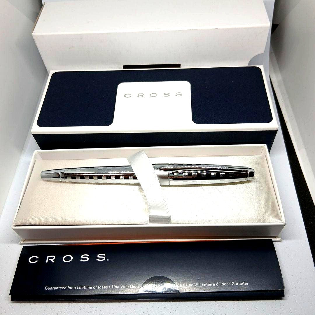 Cross brand silver metal ballpoint pen with stripe design shown in dedicated case without refill