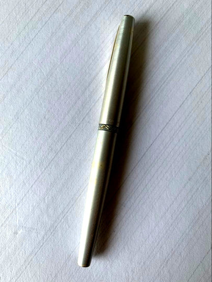 Pilot fountain pen with 22K gold nib showing slight discoloration on the body