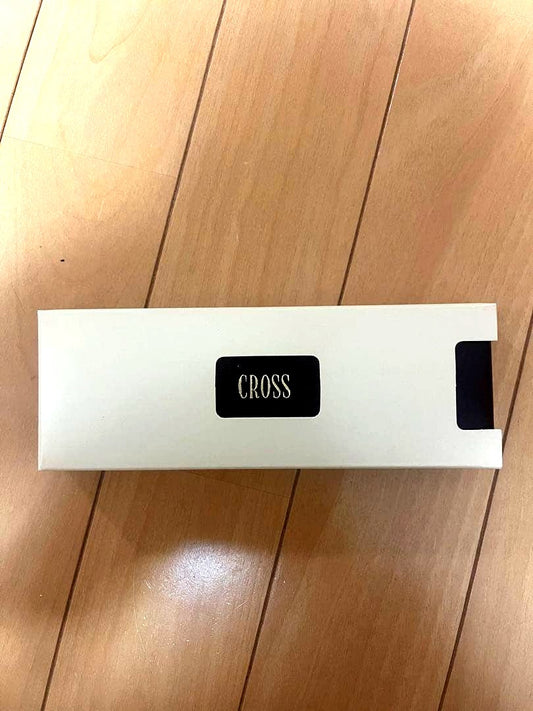 CROSS ballpoint pen with metal body and brown case shown on white background