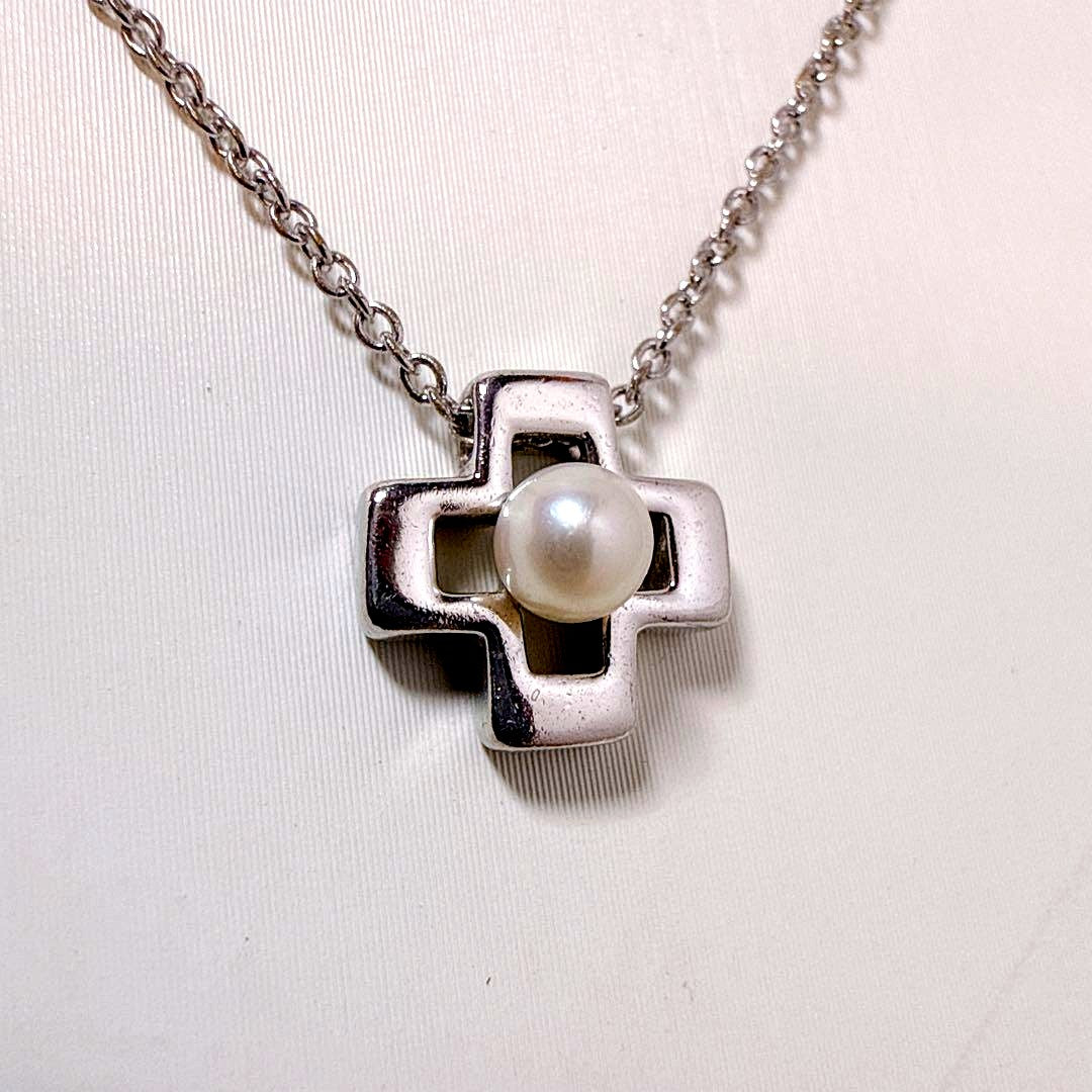 Tasaki silver cross necklace featuring a single pearl pendant on an adjustable metal chain length 39 to 42.5 cm