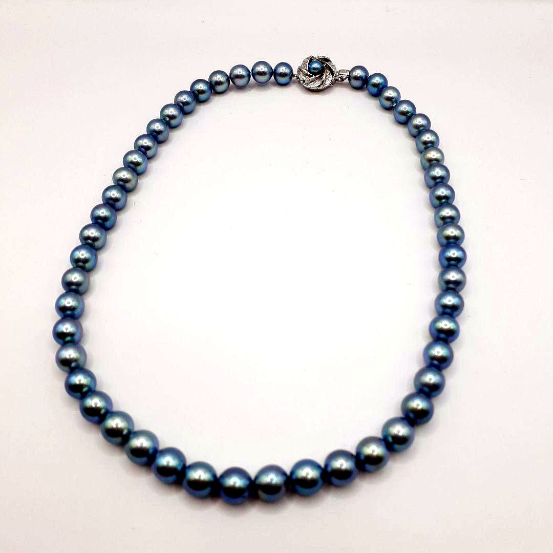 Akoya pearl necklace with 8mm pearls measuring 42.5 cm length on white background