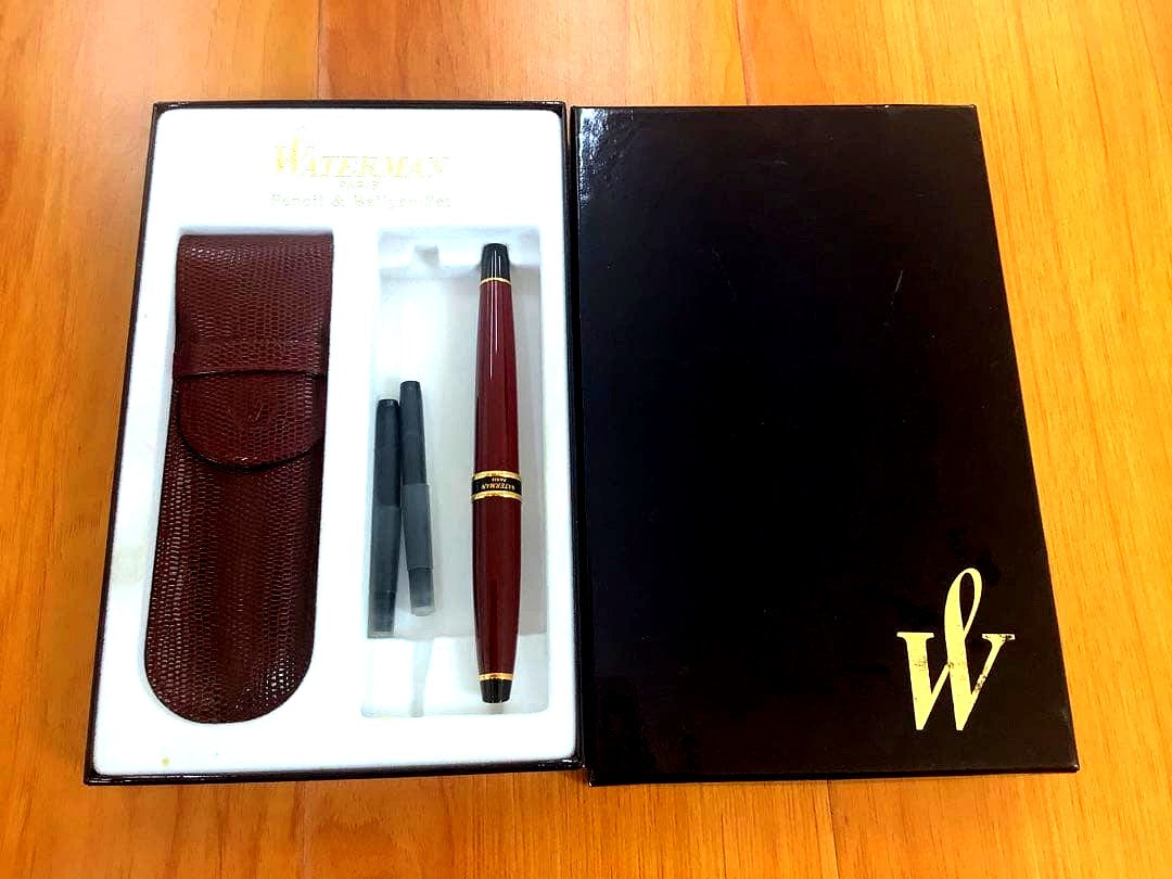 Waterman fountain pen and ballpoint pen set displayed in a brown leather case